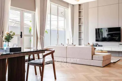 Luxurious modern living room with elegant decor and large windows