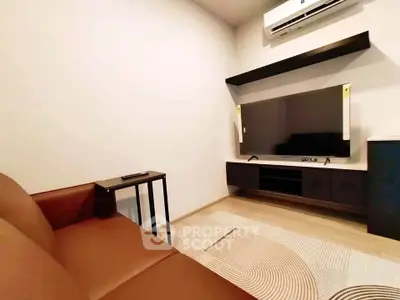 Modern living room with sleek TV setup and comfortable seating