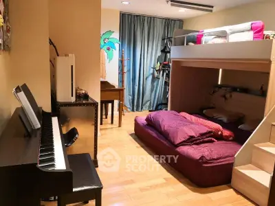 Spacious bedroom with bunk bed and piano, ideal for music lovers.