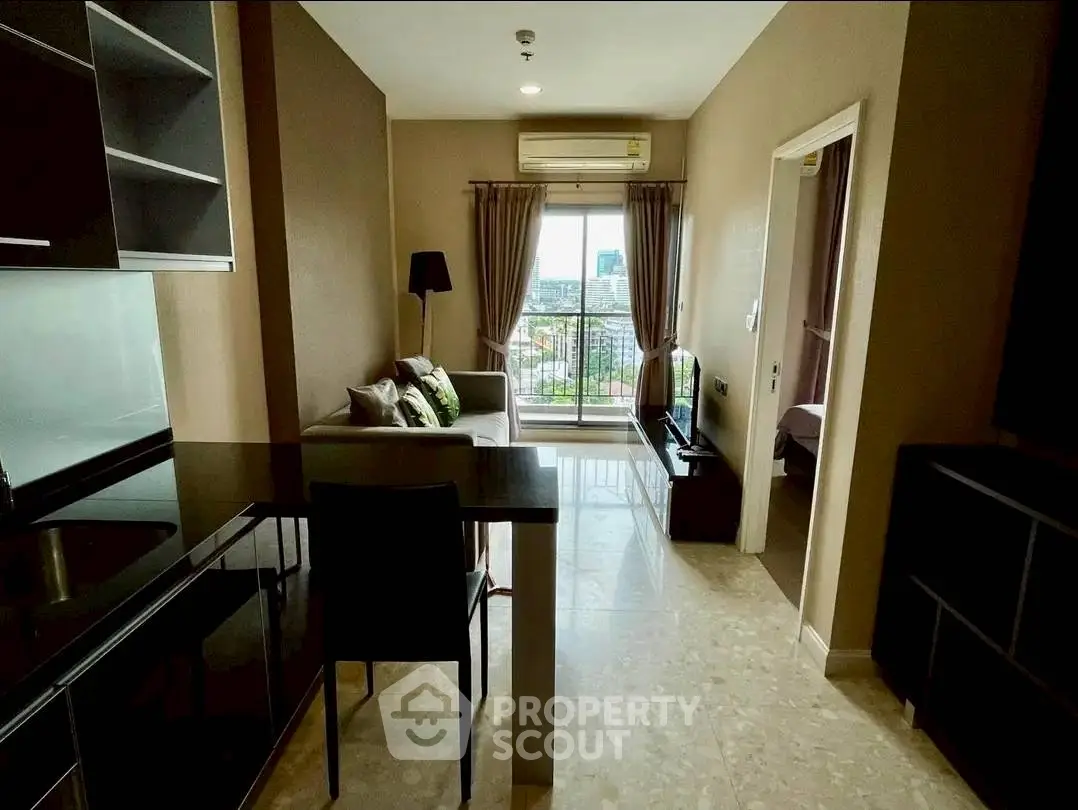Modern apartment with open layout, cozy living area, and balcony view.