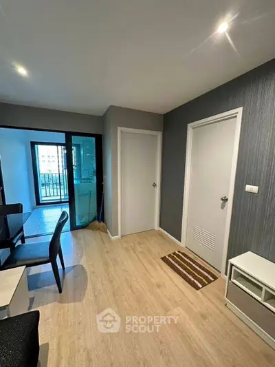 Modern apartment interior with dining area and balcony view
