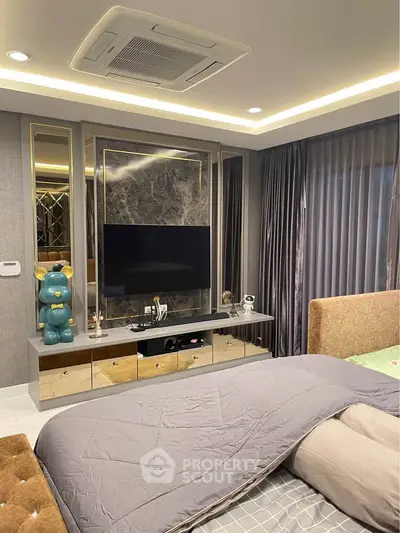 Luxurious bedroom with modern decor, plush bedding, and stylish mirrored accents for a sophisticated ambiance.