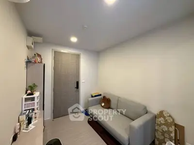 Cozy living room with modern decor and comfortable sofa, perfect for relaxation.