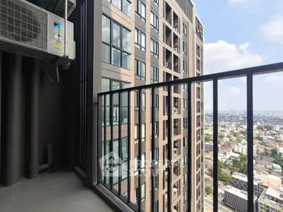 Modern high-rise balcony with city view and air conditioning unit.