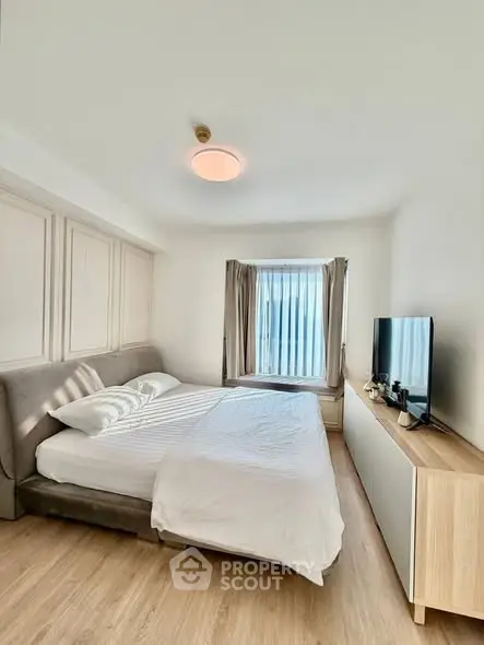 Bright and cozy bedroom with modern furnishings and natural light