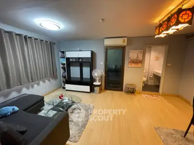 Cozy living room with modern decor and wooden flooring