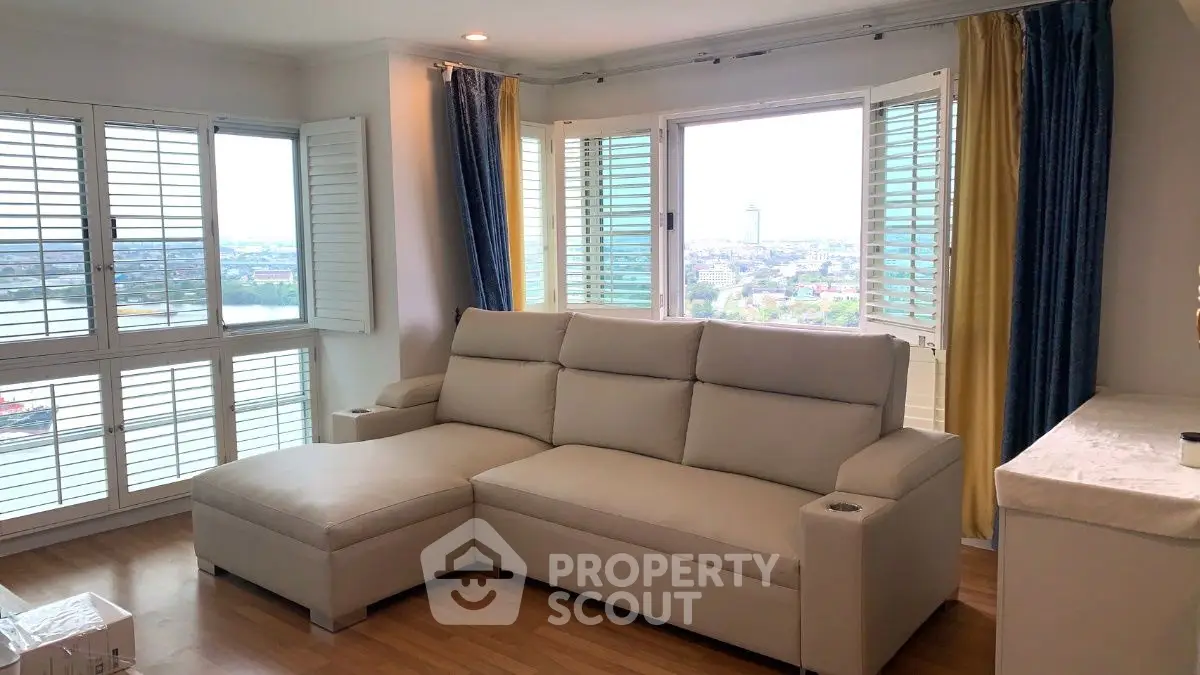 Spacious living room with panoramic city view and elegant furniture