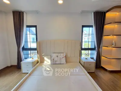 Elegant bedroom with modern design and ample natural light