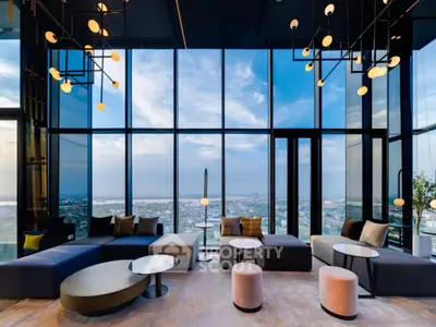 Luxurious modern living room with panoramic city view and stylish furniture