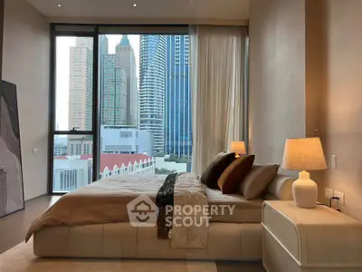 Luxurious bedroom with stunning city view in modern high-rise apartment