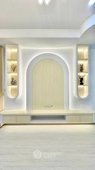 Modern living room with elegant built-in shelving and soft lighting