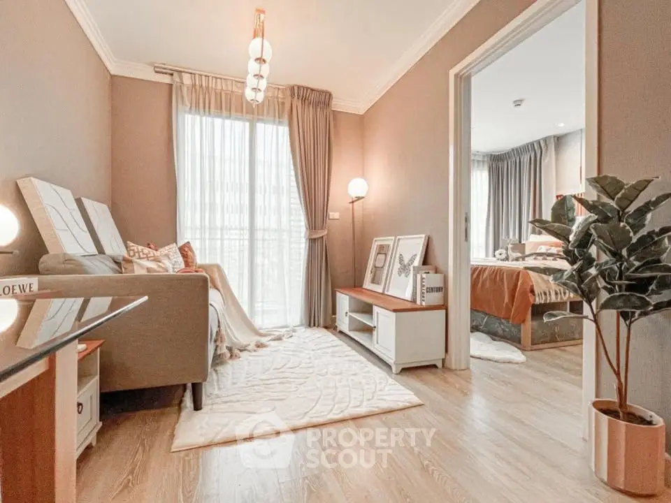 Stylish living room with cozy decor and view into a modern bedroom, perfect for urban living.