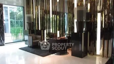 Luxurious modern lobby with sleek decor and elegant seating area.