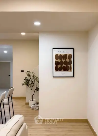 Modern living room with minimalist decor and wooden flooring