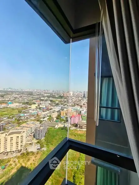 Stunning corner unit with panoramic city view from high-rise building window.