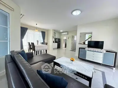 Spacious living room with modern furniture and natural light