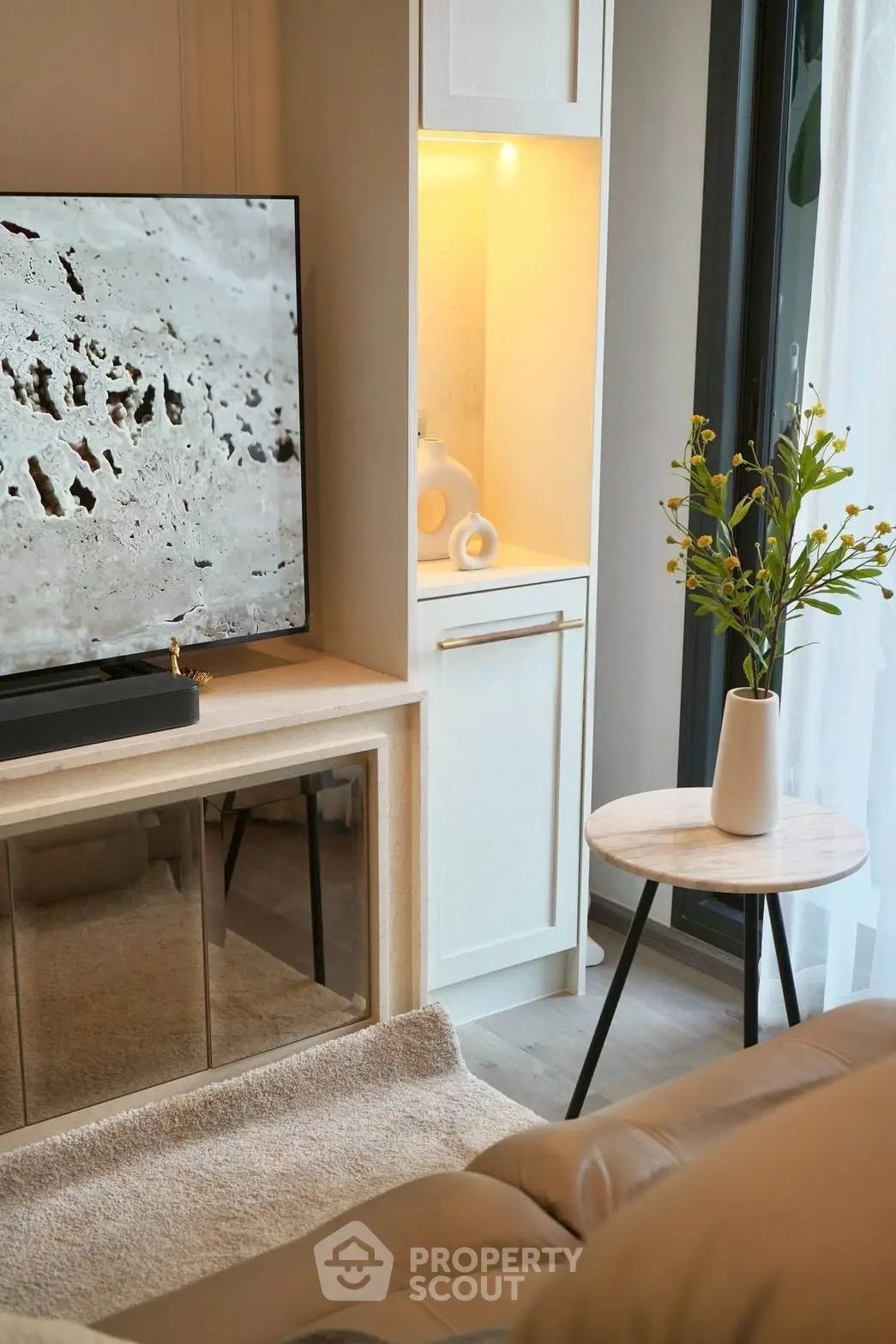 Modern living room with sleek TV setup and elegant decor