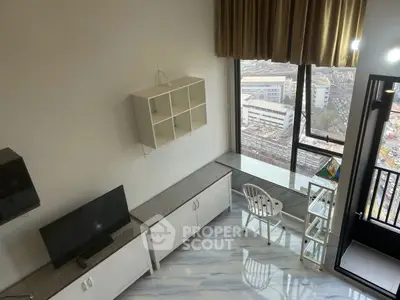 Modern high-rise apartment with stunning city view and sleek interior design.