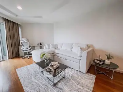 Spacious modern living room with elegant white sofa and stylish decor