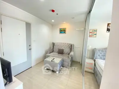 Cozy living room with plush seating and modern decor in a bright apartment