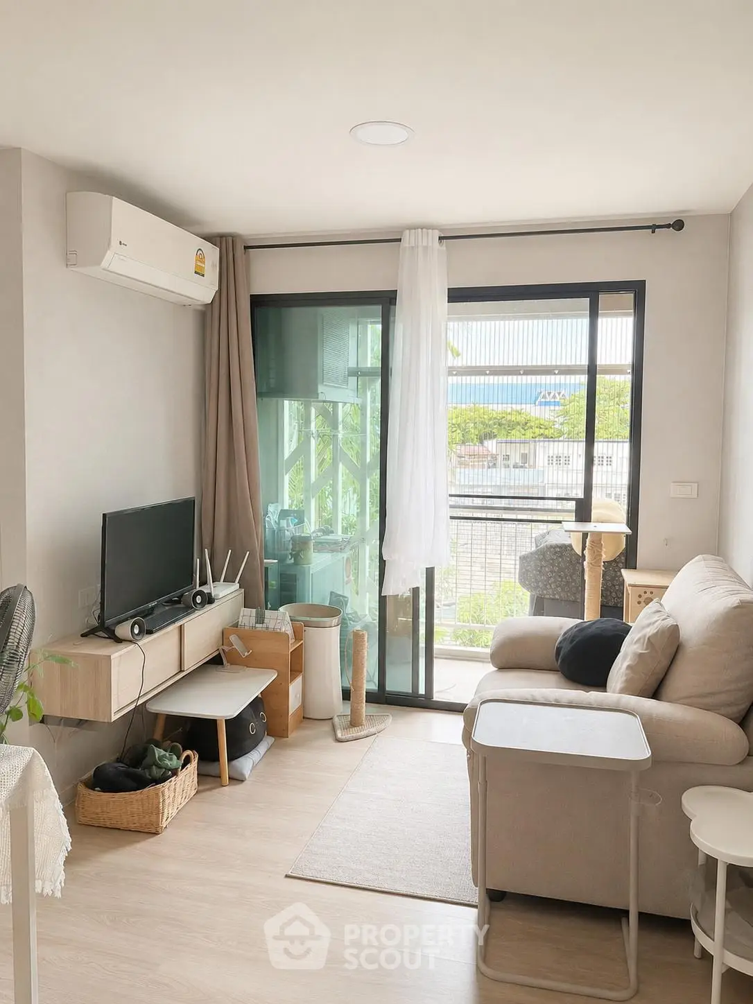 Cozy living room with modern decor and balcony view