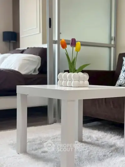 Modern living room with stylish white coffee table and cozy decor