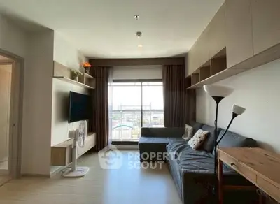 Modern living room with large window and stylish furniture