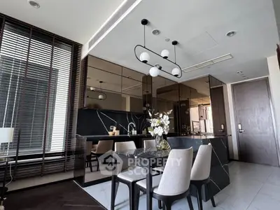 Luxurious modern kitchen with sleek black marble countertops and elegant dining area