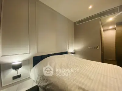 Modern bedroom with elegant lighting and cozy ambiance