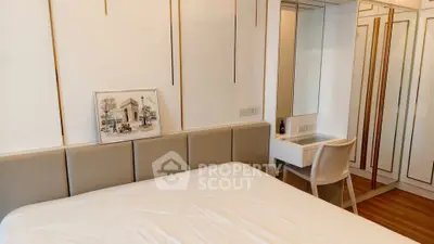 Elegant bedroom with modern decor and built-in vanity in luxury apartment