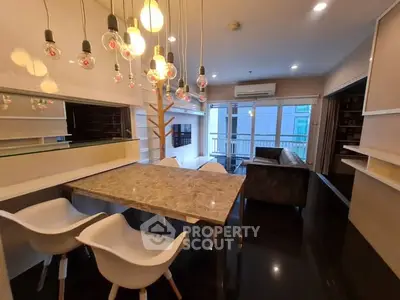 Modern living room with elegant lighting and marble dining table