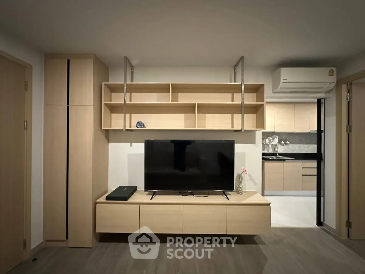 Modern living room with sleek wooden furniture and built-in TV unit
