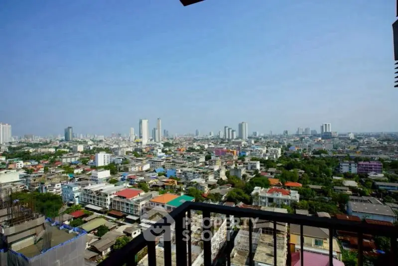 Stunning cityscape view from a high-rise balcony, showcasing urban living at its finest.