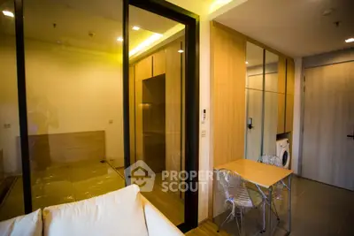Modern apartment interior with cozy living area and compact kitchen