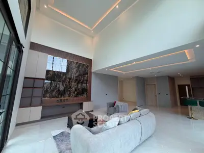 Luxurious modern living room with high ceilings and elegant decor