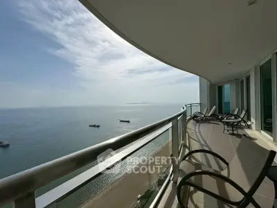Stunning oceanfront balcony with panoramic sea views and modern seating, perfect for relaxation.