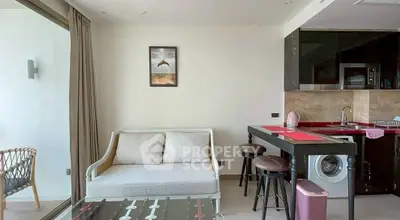 Modern living room with stylish furniture and open kitchen layout