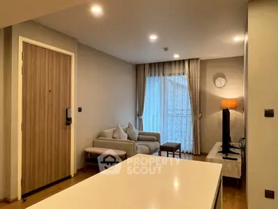 Modern living room with cozy sofa, flat-screen TV, and elegant decor in a stylish apartment.