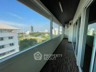 Spacious balcony with panoramic city view in modern apartment
