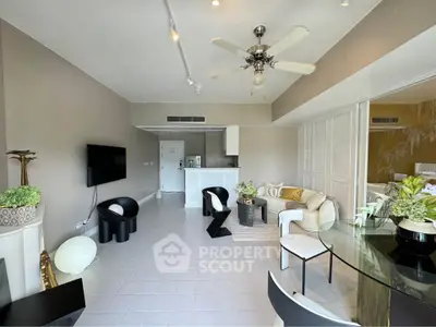 Spacious modern living room with stylish furniture and open kitchen layout