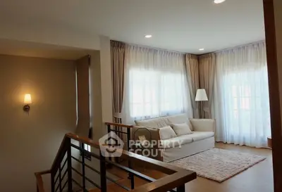 Spacious living room with elegant decor and natural light