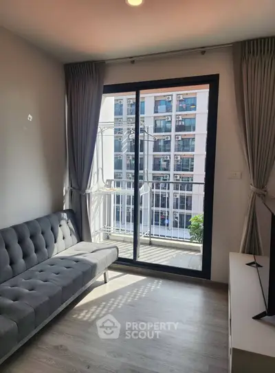 Modern living room with balcony view in urban apartment