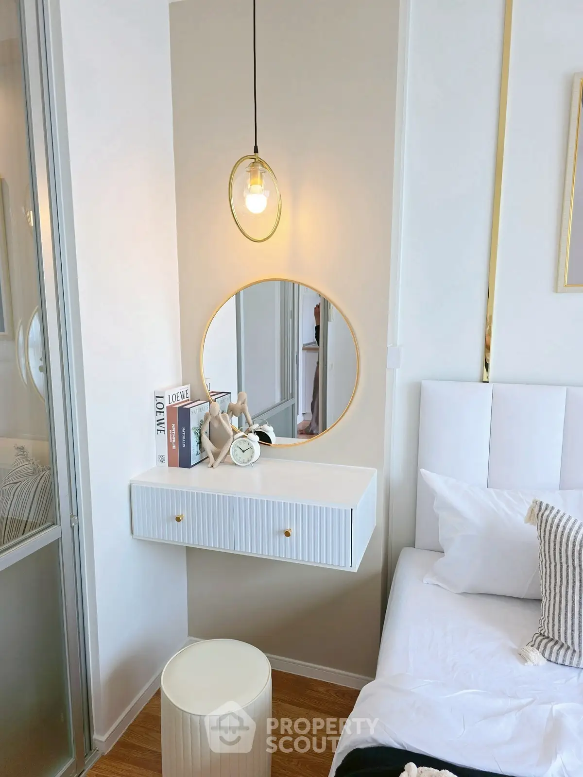 Stylish bedroom corner with modern decor and elegant lighting