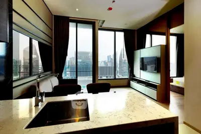 Luxurious modern living room with city view, featuring sleek design and high-end finishes.