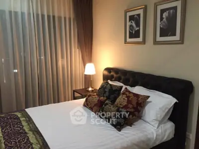 Elegant bedroom with stylish decor and cozy lighting in modern apartment.