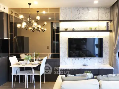 Luxurious modern living room with elegant dining area and stylish lighting fixtures.