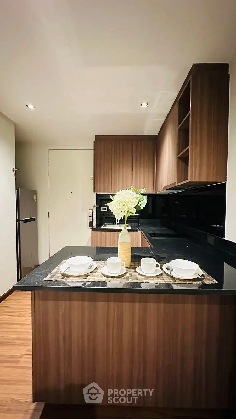 Modern kitchen with sleek wooden cabinets and stylish island setup