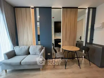Modern living room with cozy sofa and dining area in stylish apartment