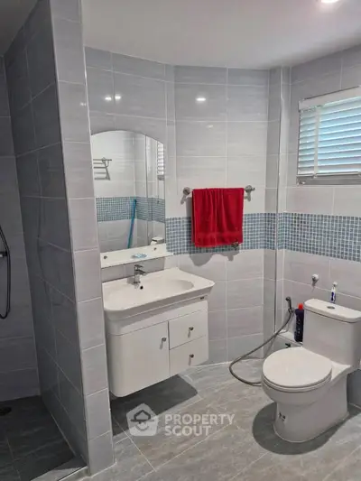 Modern bathroom with sleek tiles and contemporary fixtures