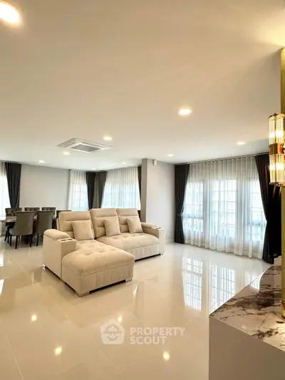 Spacious modern living room with elegant decor and ample natural light